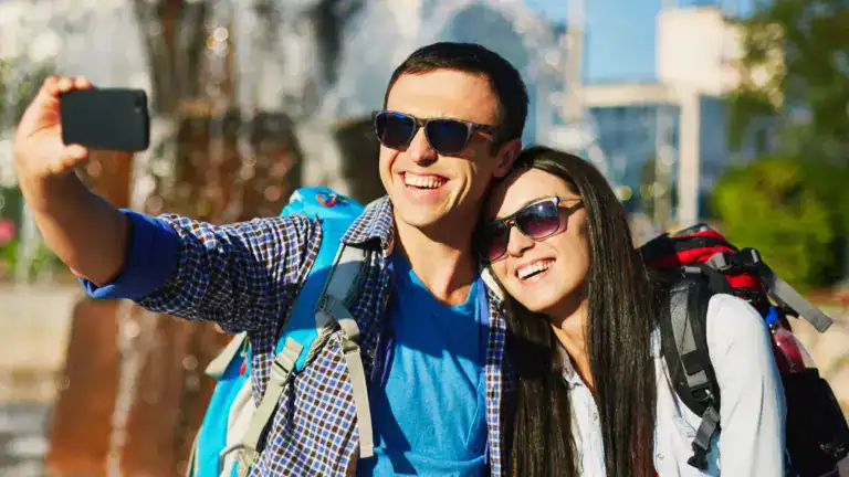 traveling young couple taking selfy