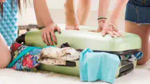 women packing suitcase