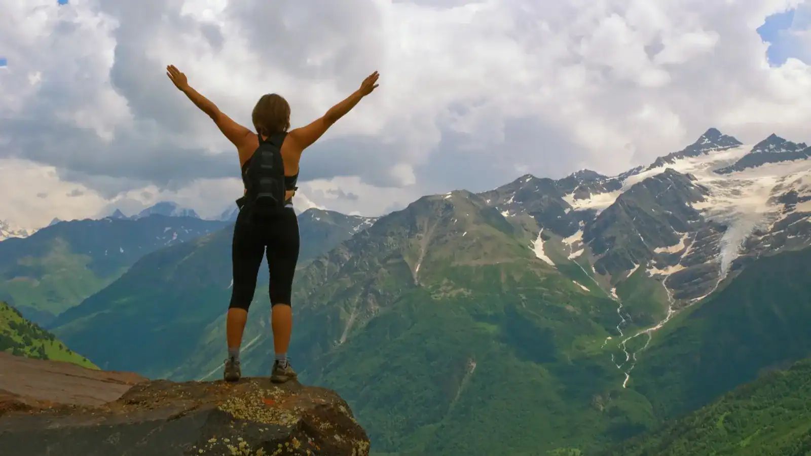 young beautiful girl in mountains